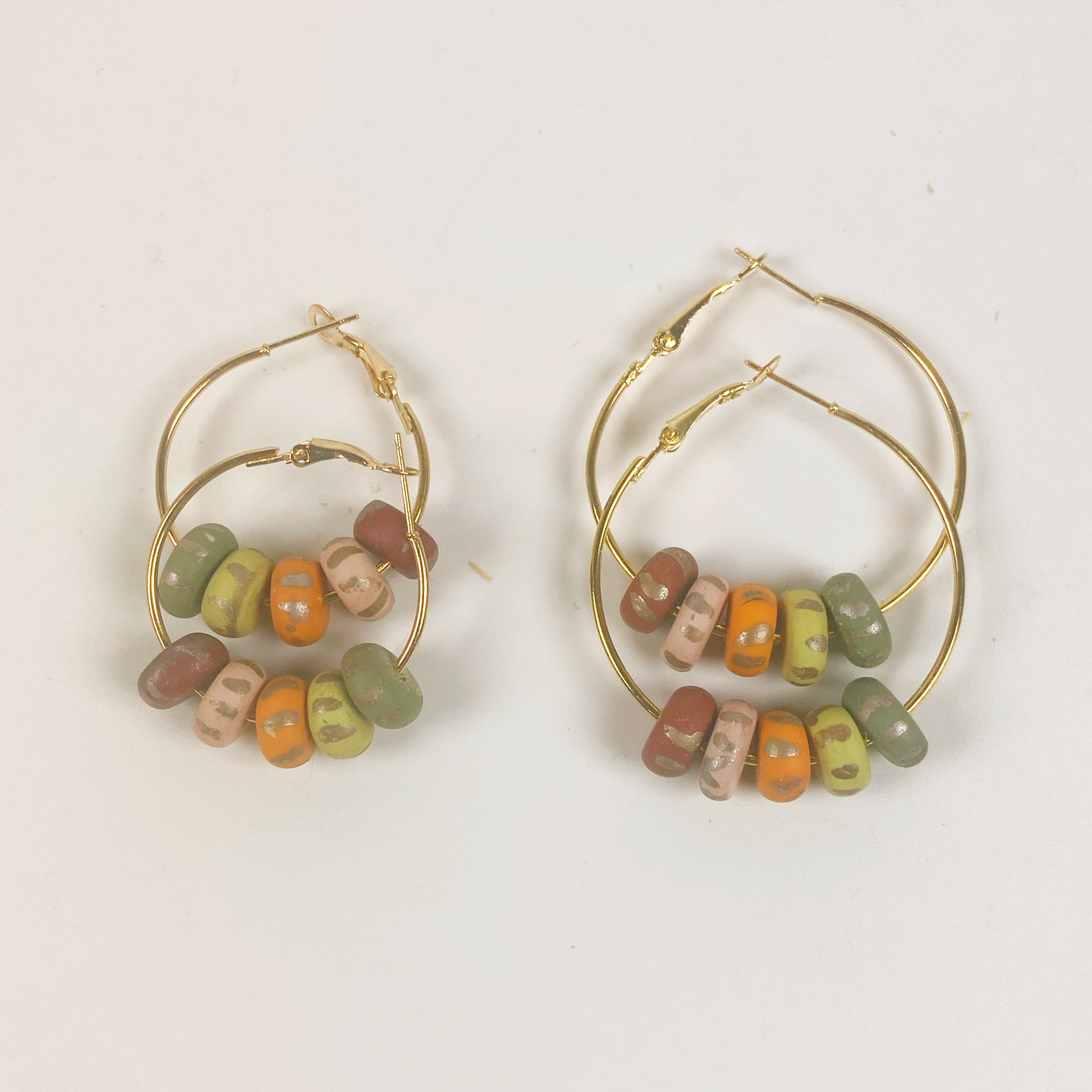 Handmade Polymer Clay Small Hoop Earrings with Autumn Beads together with similar large hoops for size comparison.