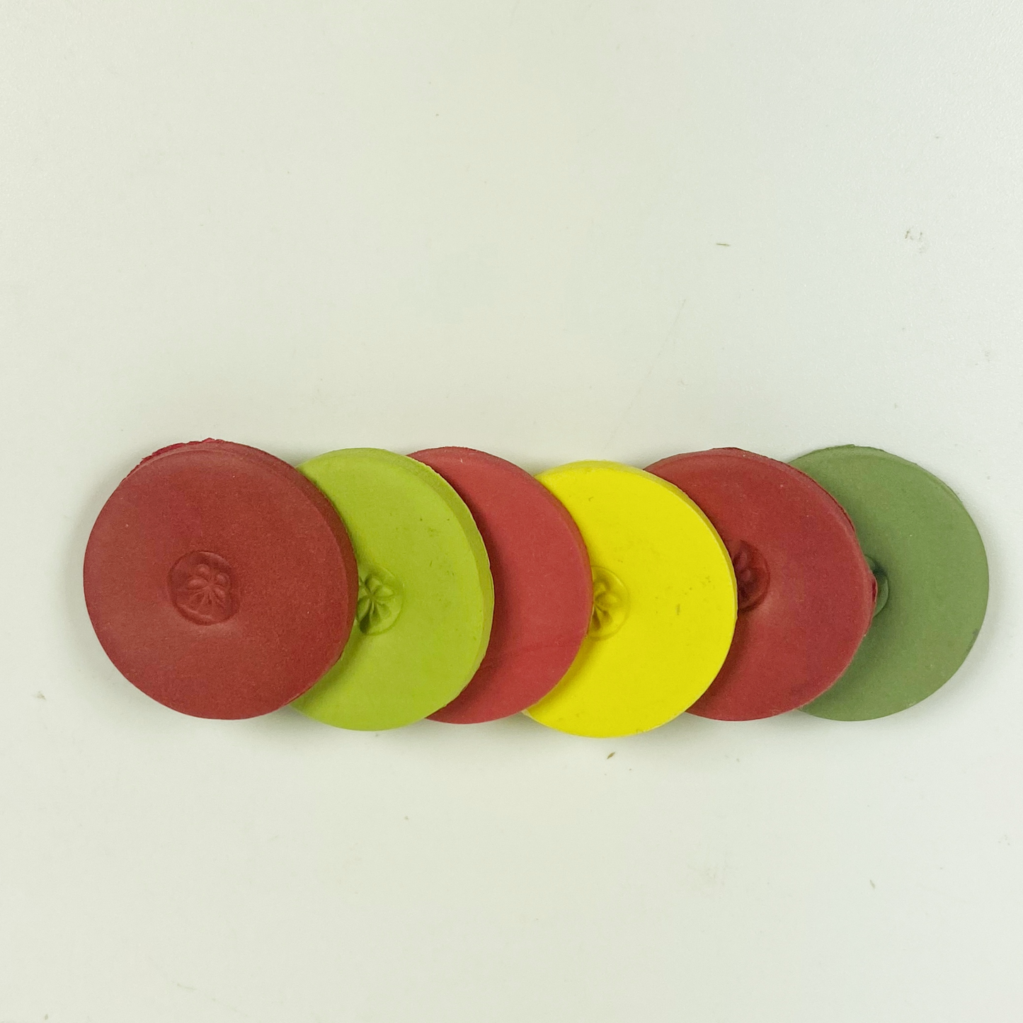 The 6 polymer clay colors of Apple Orchard Palette shown in sample discs stacked in a cascade.